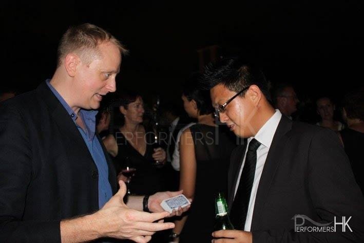 Magician preparing his card trick for a guest
