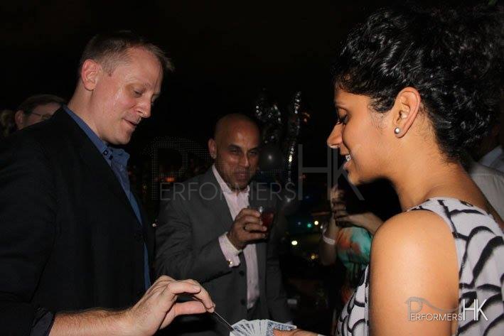 Magicians Shaun do magic tricks at a cocktail party in Hong Kong