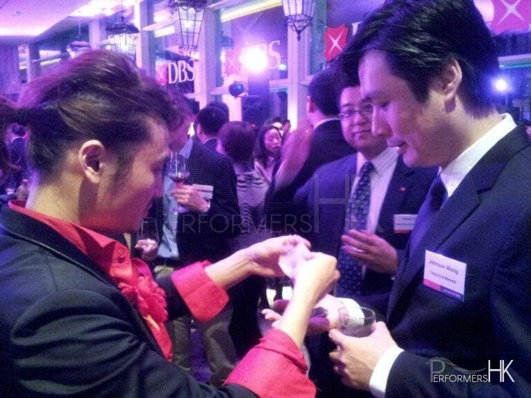Hong Kong Magician performing roving card magic at DBS Hong Kong cocktail party