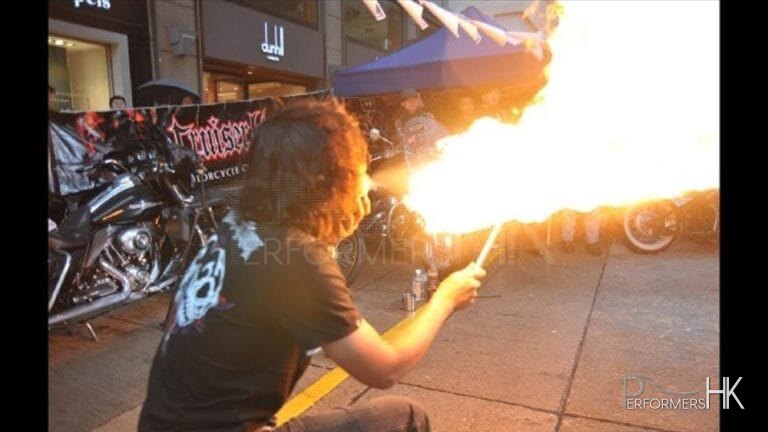 HK fire juggler Breathing fire at a corporate street show