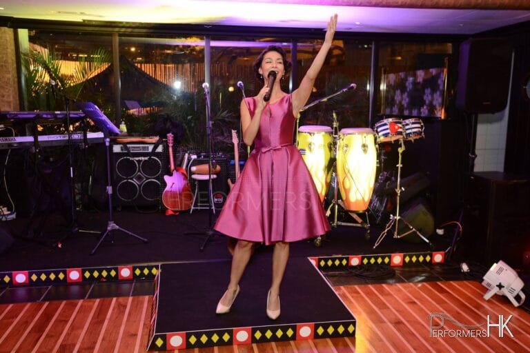 Yamilete in pink dress on stage in Hong Kong