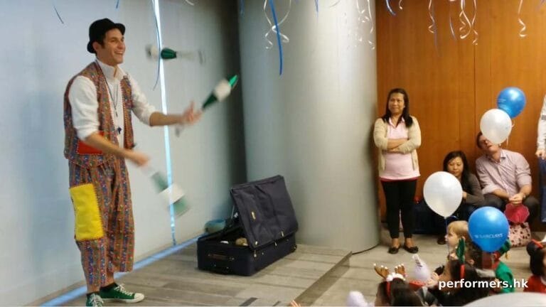 Roving juggler in HK juggling three cups at a corporate xmas event