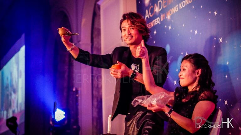 Hong Kong Magician impressed a guest by performing a stage magic with fruit at a corporate event