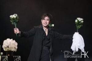 Hong Kong magician performing roving magic with white roses on valentine day