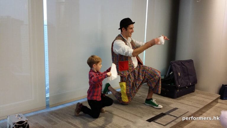 Bain Capital Asia Christmas party balloonist performance with children on stage