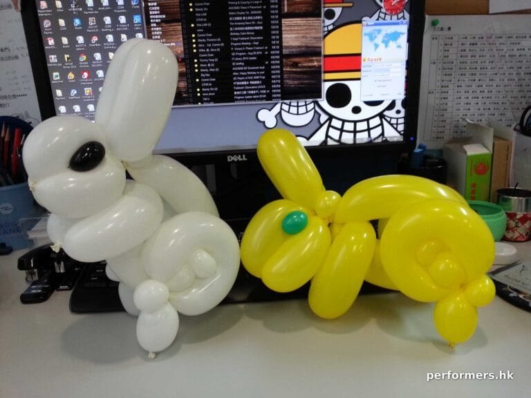 HK Roving balloon artist twisted two rabbit balloons for a Hong Kong mid autumn festival event