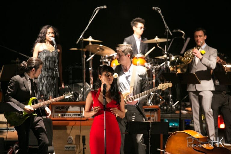 Vocalist with band performing fusion pop music