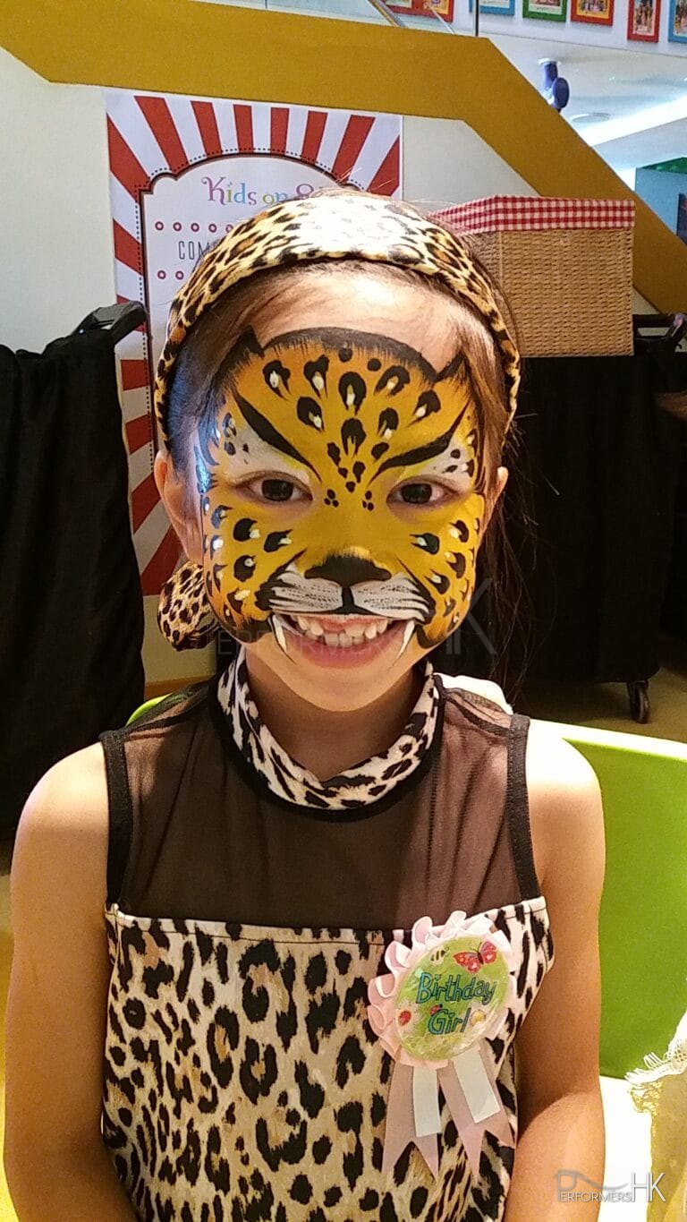 little girl with face painted tiger in Hong Kong