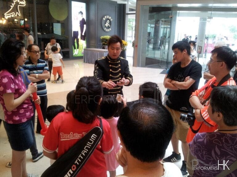 Hong Kong Walk around magician performing card trick to the audience at Popcorn Mall store opening event