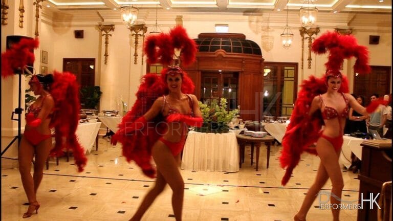 Three Vegas Showgirl dancers in Hong Kong dancing in a corporate annual diner party