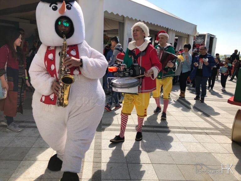 3 different instruments musicians walk around xmas music band in hong kong