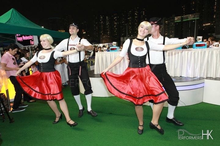 Two pair of dancers doing Bavarian dance at Hong Kong Jockey Club Oktoberfest event