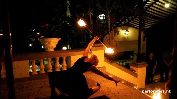 Hong Kong Fire juggler playing fire staff at a corporate annual dinner