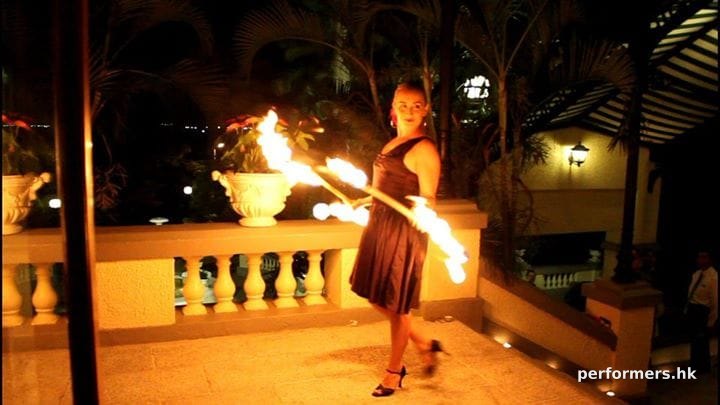 Fire juggler performing with Fire hoop in Hong Kong at a annual dinner