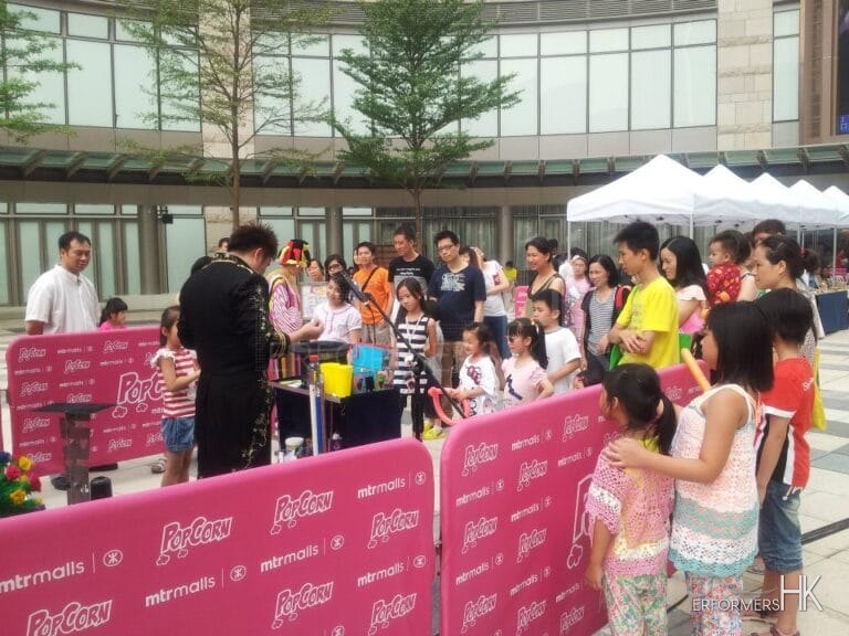 Hong Kong Magician performing with a child audience at Hong Kong Popcorn Mall