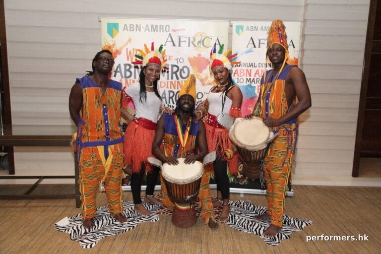 Dancers with drummers at event