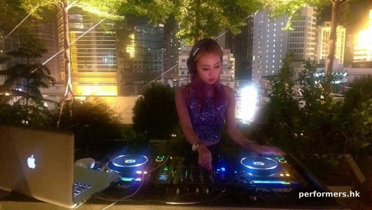 DJ Bezi in Hong Kong with buildings in the background