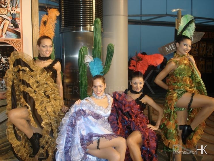 4 can can dancers posing for photo with different color can can costumes