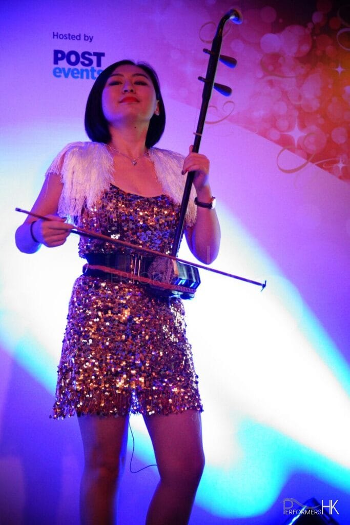 Girl in costume performing on stage in gold costume