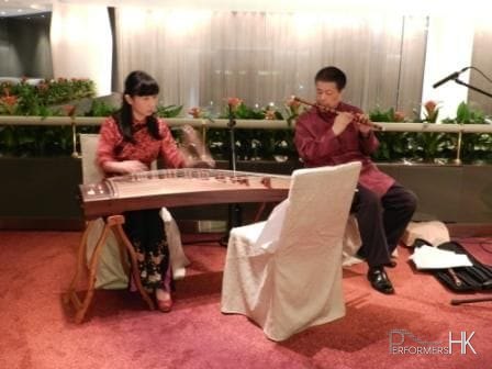 Two Chinese musicians performing live traditonal Chinese music