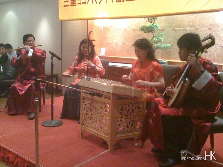 Four Chinese musicians performing at a dinner event
