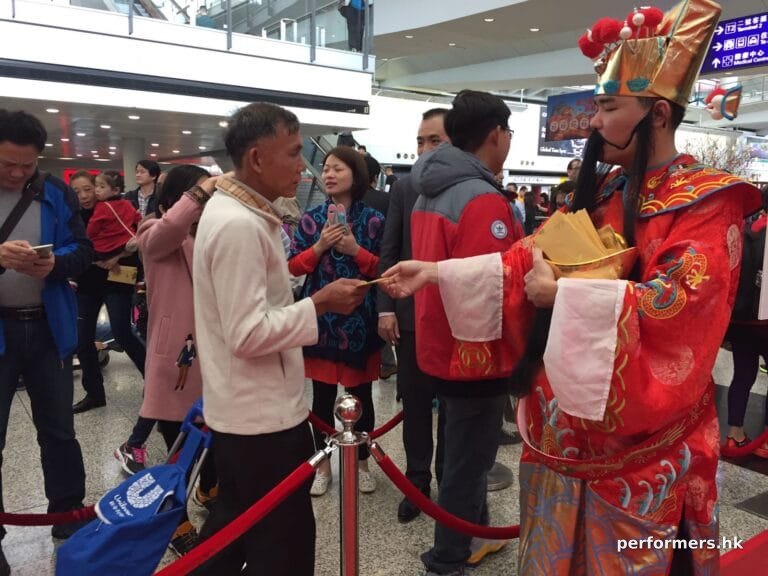 Danny Choi Sun at Airport with guests taking red packet