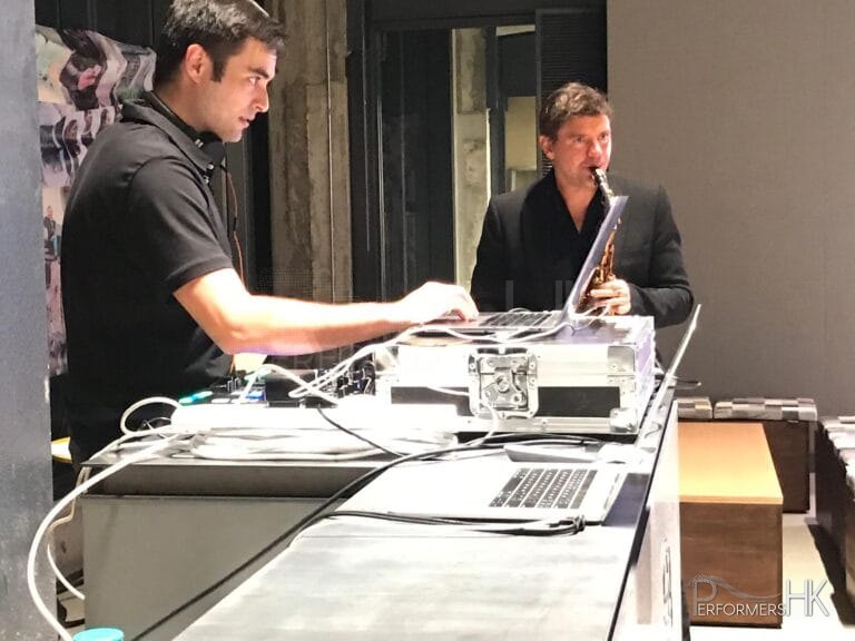 DJ With sax player at an event in hk wearing black top
