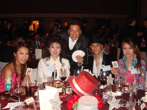 Magician performs table magic with cards to four celebrities at Watsons Hong Kong annual dinner