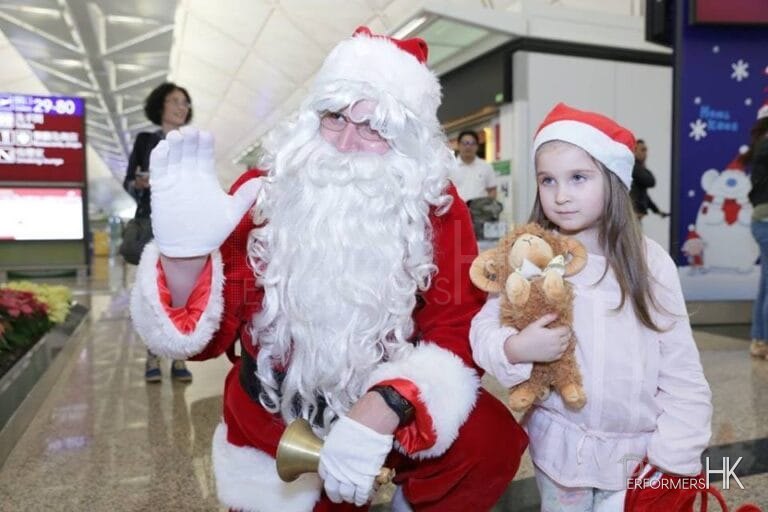 Santa Dave C in Hong Kong international Airport with a young fan