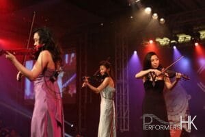 Three Hong Kong violinist performing electric trio at a watch company product launch event