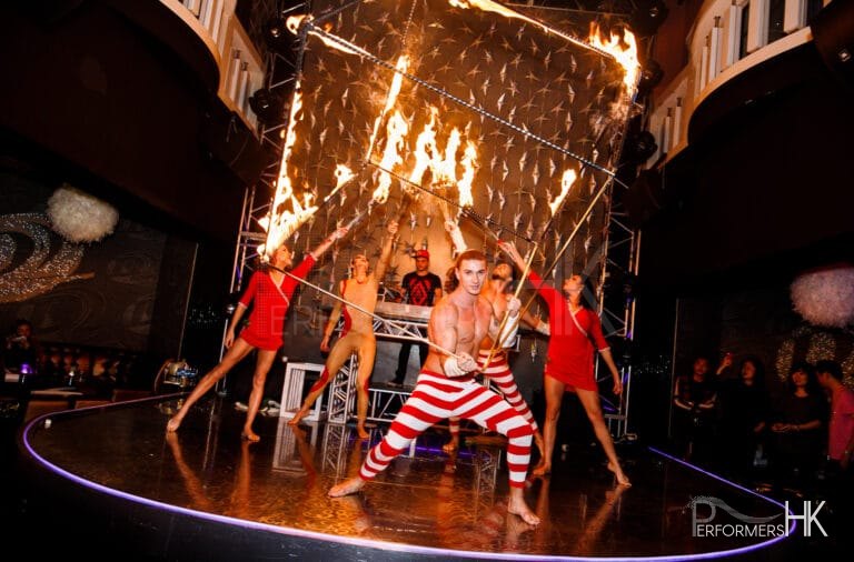 Five talented fire performer in Hong Kong performing with fire staff and fire cube at a night club store opening event