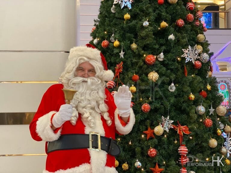 santa next to christmas tree in tst hk