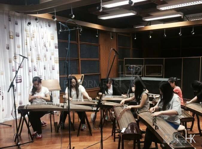 Girl musicians recording their instruments