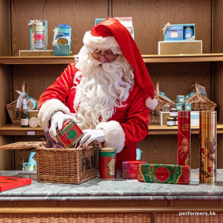 Santa Hugh packing picnic basket with F&M logo on
