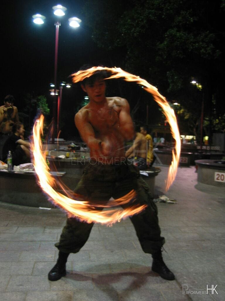 Hong Kong Juggler performing with fire poi at a corporate event