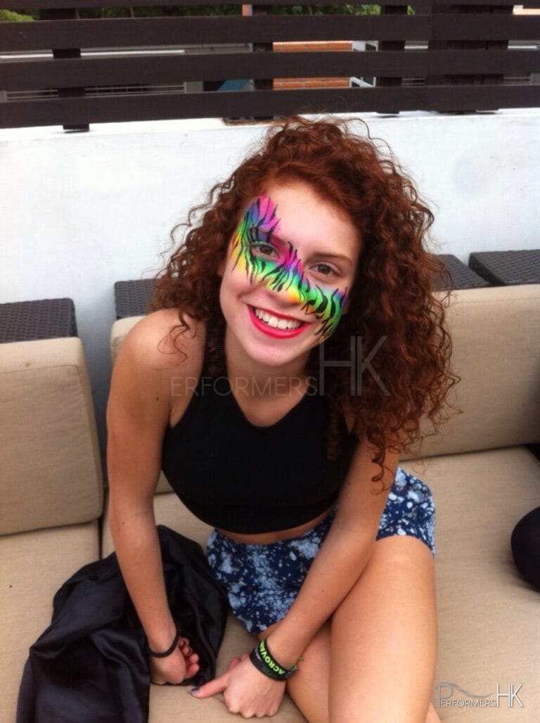 Hong Kong professional face painter draw a rainbow color zebra pattern face paint for a lady who attended a carnival event