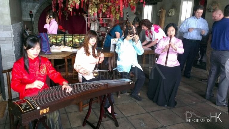 Four Chinese musicians in Hong Kong performing at a corporate Chinese theme event during Chinese new year