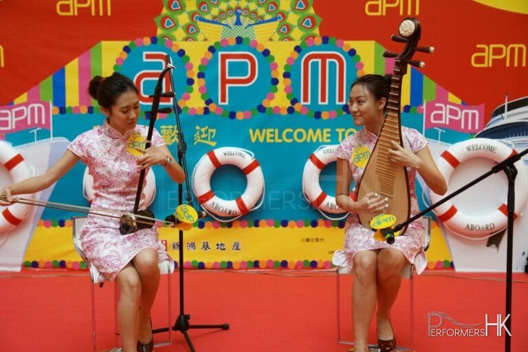 Two HK Chinese music musicians playing Erhu and Pipa at a shopping mall event