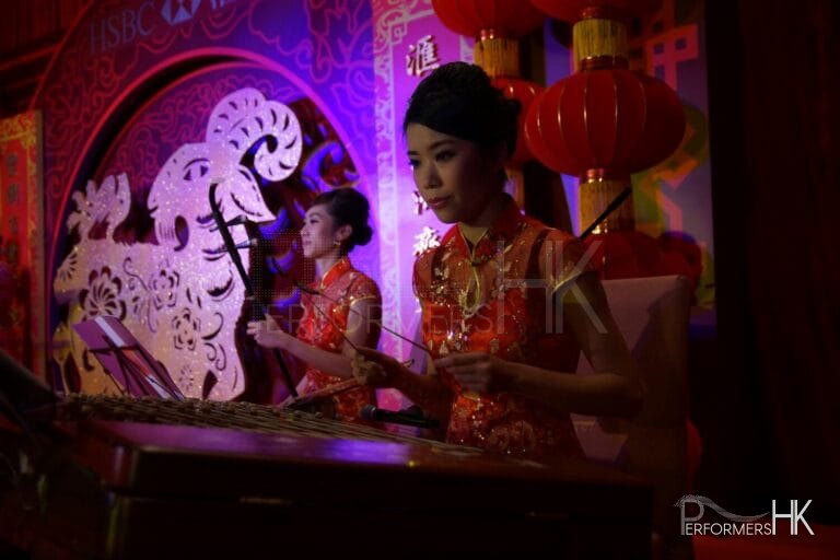 Two Chinese music musician playing Erhu and Yangqin at a Hong Kong Bank annual dinner