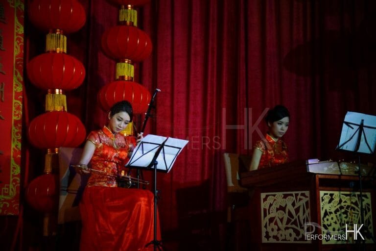 Hong Kong two Chinese music musicians playing Chinese traditional instrument Erhu and Yangqin at a annual dinner