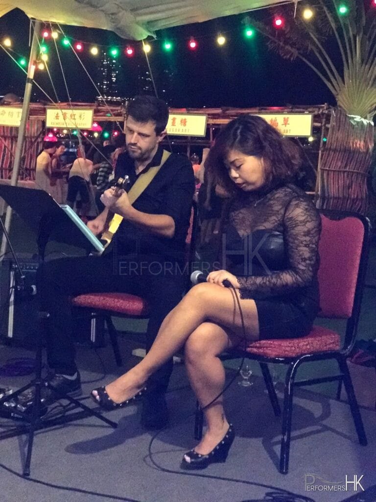 HK Country club event in Hong kong playing guitar and singing cantonese music for geusts