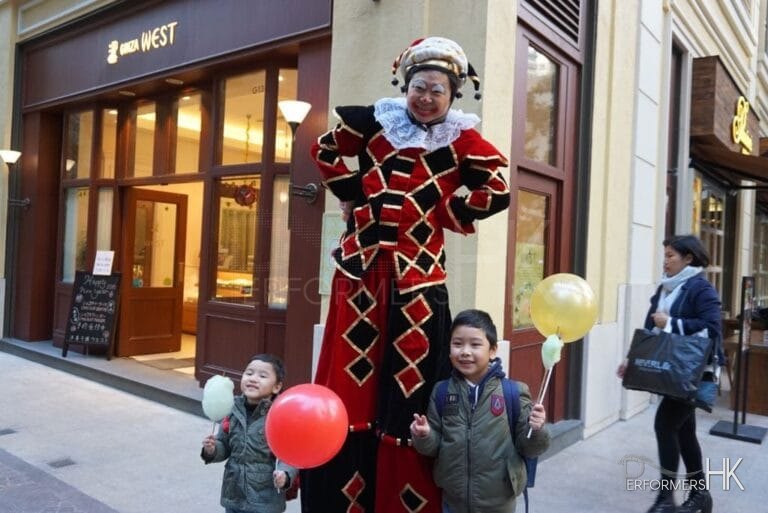 Stilt costume performer in the streets of hong kong performinhg