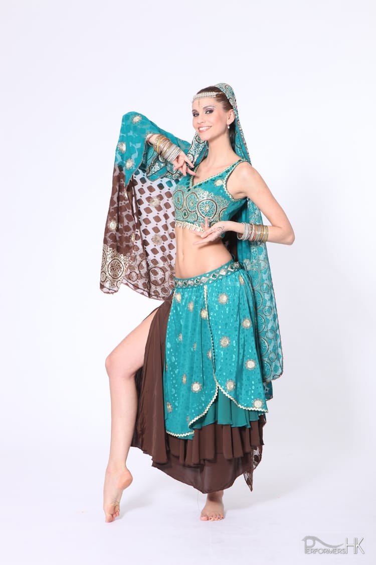 Bollywood dancer wearing teal costume with gold embroidery