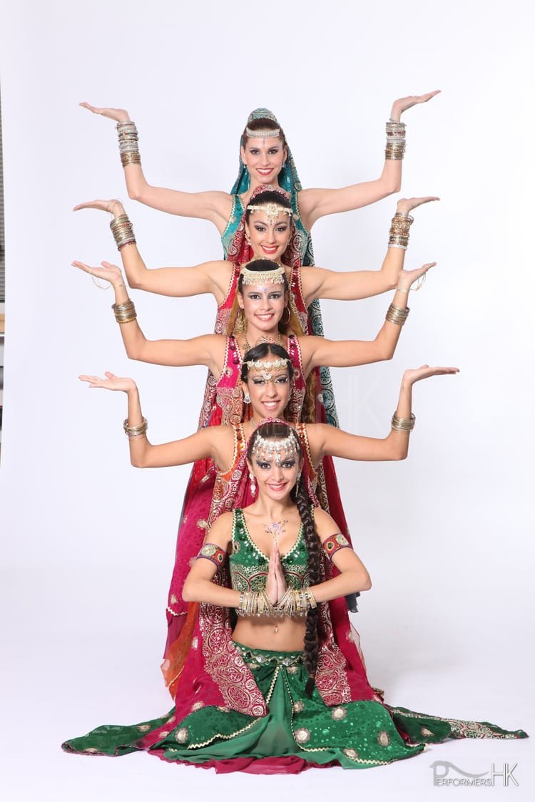 Six Bollywood dancer in HK wearing traditional Bollywood Dance costumes, posing as a line for a promote photo for a annual dinner