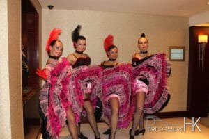 four can can dancers wearing pink dresses at HKCEC