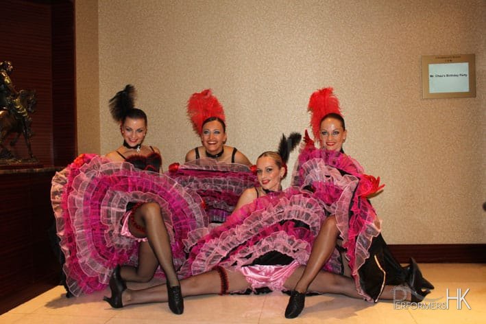 4 dancers posing in the hallway just before performance