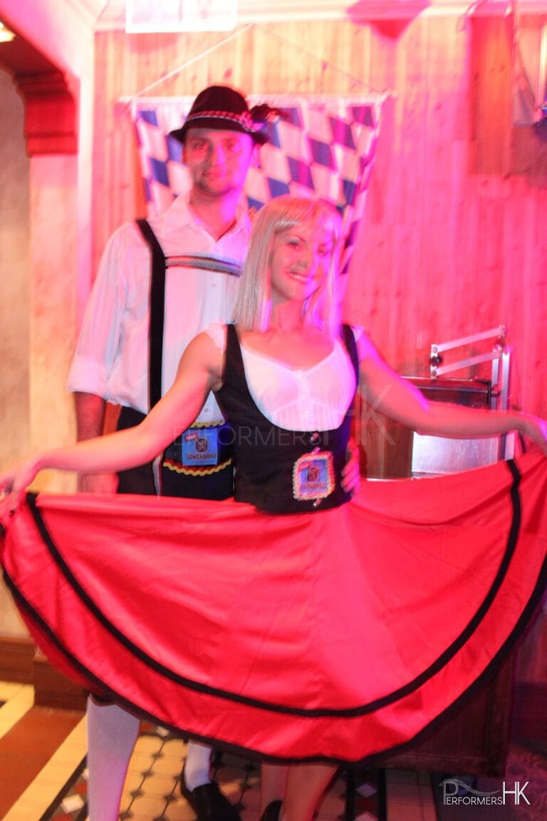 Male and female German dancers at Oktoberfest event at Jockey Club in Hong Kong