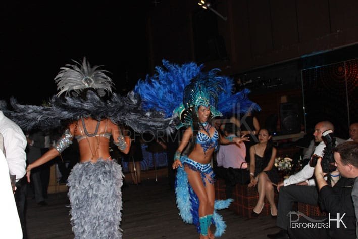 two samba dancers dancing whilst guests look on