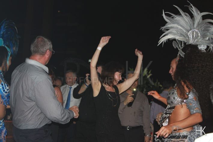 Samba dancers and guests dancing at cocktail party
