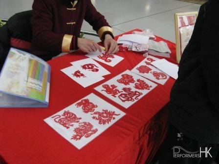 HK Artist cutting Chinese zodiac animal paper at a CNY event